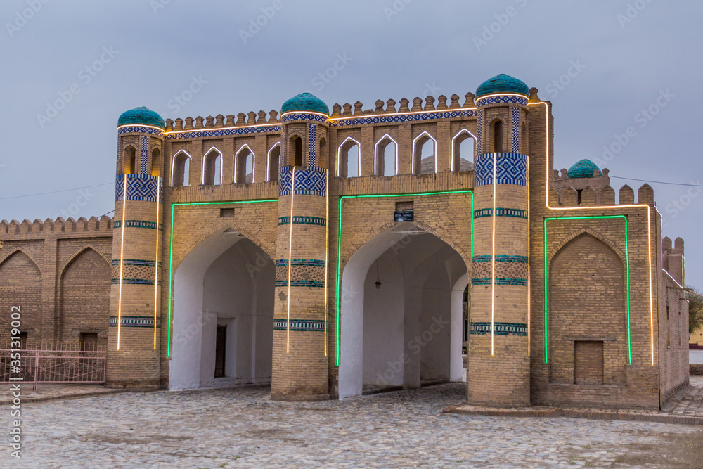Illuminated ancient gate in Khiva, Uzbekistan