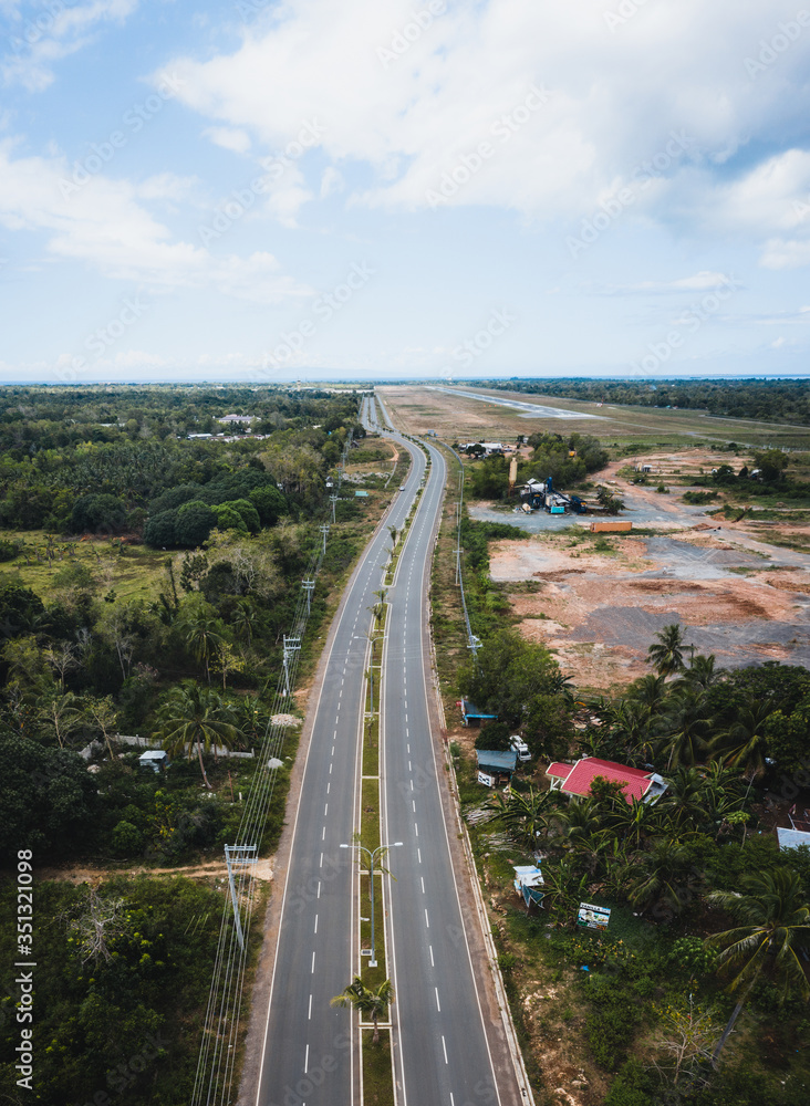 Aerial view of an empty highway due to the coronavirus pandemic in Panglao, Bohol, Philippines Aerial view of an empty highway due to the coronavirus pandemic in Panglao, Bohol, Philippines