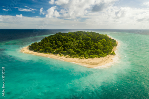 Aerial view of uninhabited island Bilang Bilangan, near Borneo, Indonesia. This island serves as protected conservation locality for endangered species of the sea turtles. photo