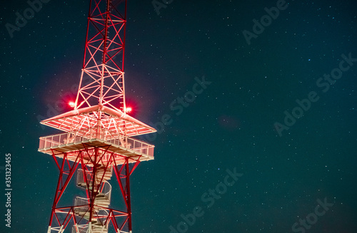 telecommunication tower on stary sky background
