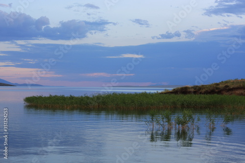 Fototapeta Naklejka Na Ścianę i Meble -  Evening at the lake, natural colors, background, no people