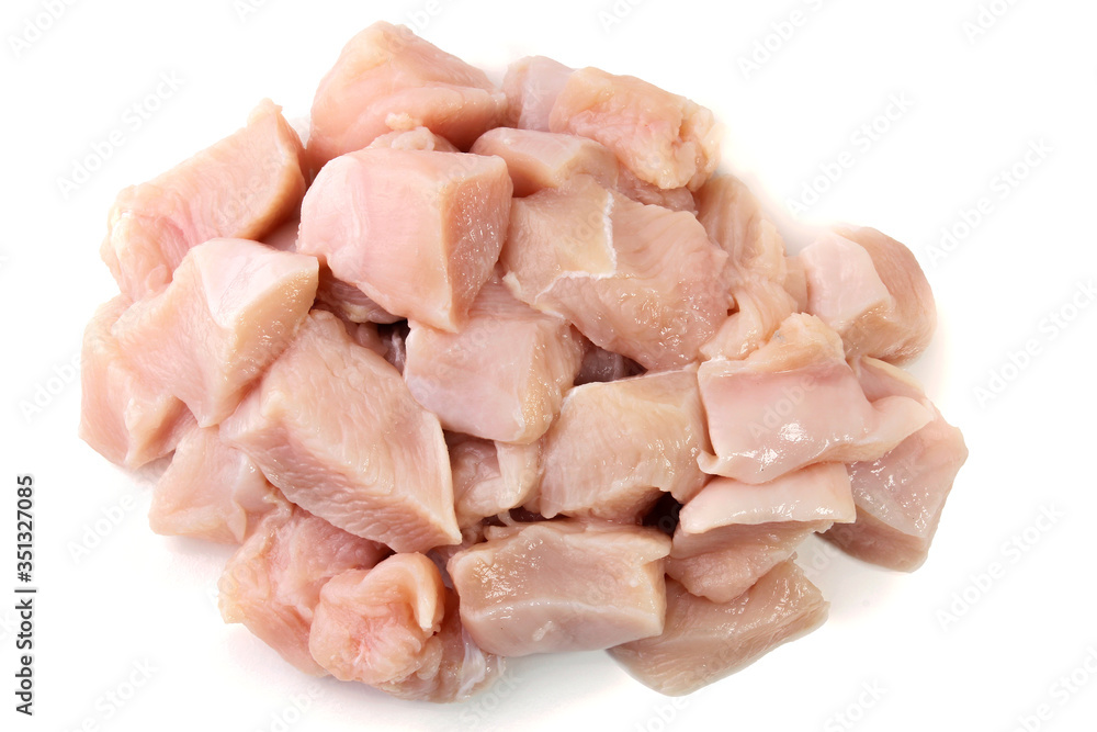 pile of fresh diced and sliced raw chicken breast, cube form, isolated on white background pile of fresh diced and sliced raw chicken breast, cube form, isolated on white background