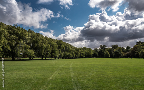 The park in Cambridge during the summer. Trees, grass and blue sky. © Marek