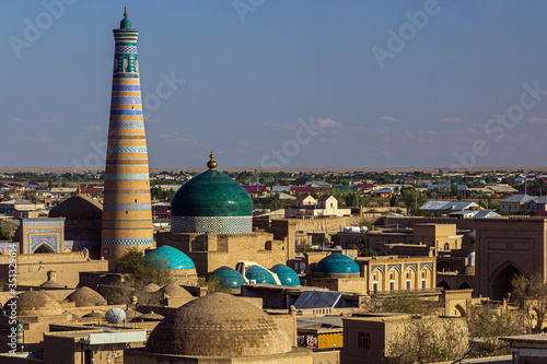 Islam Khoja Minaret and Pakhlavan Makhmoud Mausoleum in the old town of Khiva, Uzbekistan. photo