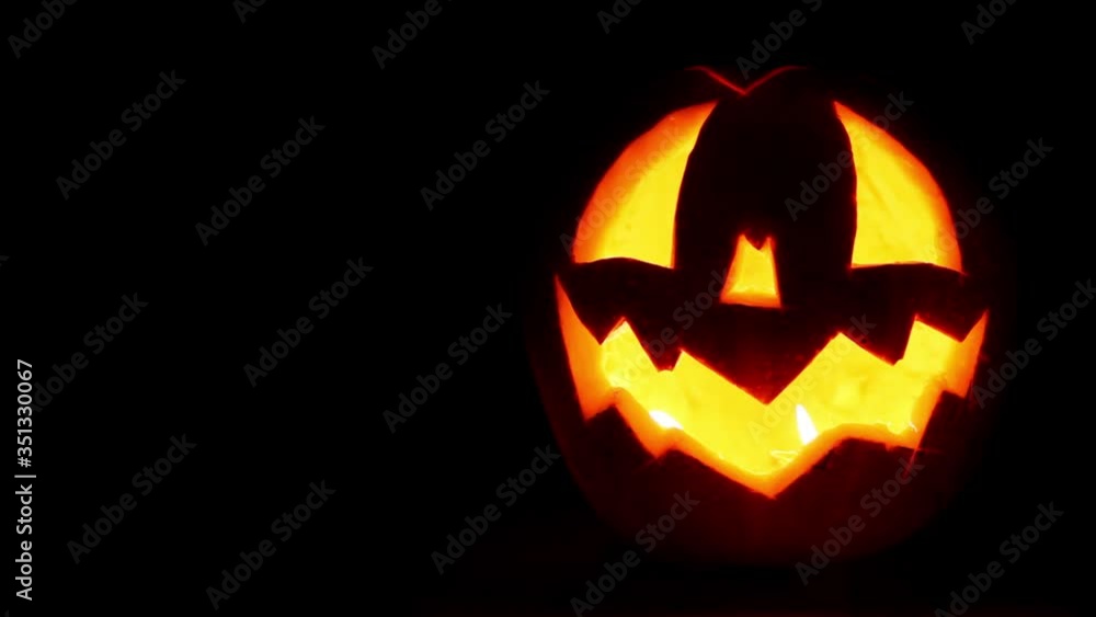 Halloween Jack-o'-lantern symbol face on the
black background Halloween Jack-o'-lantern symbol face on the
black background