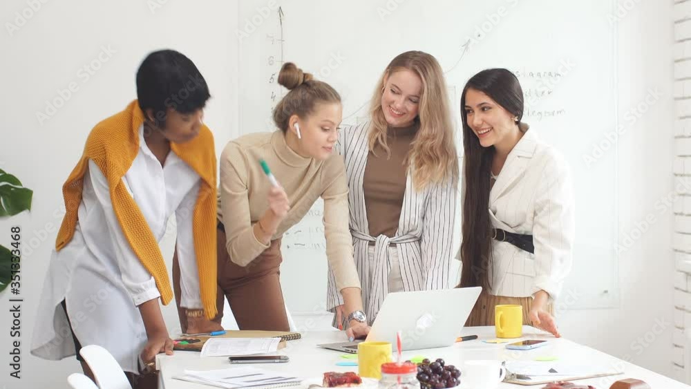 Group of diverse happy coworkers female discussing in conference room, business startup concept. Group of diverse happy coworkers female discussing in conference room, business startup concept.