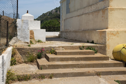 Old stairs near the historical lighthouse on the Atlantic Ocean coast on the Cape Spartel in northern Morocco.