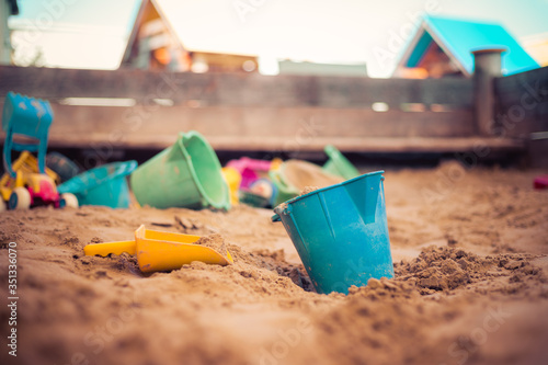 Childhood sandbox concept: Close up of plastic toy bucket photo
