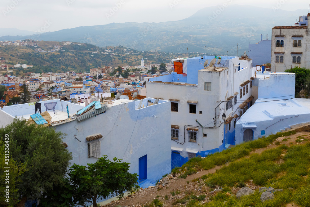 View of the blue walls of old buildings in Chefchaouen, Morocco. The city, also known as Chaouen is noted for its buildings in shades of blue and that makes Chefchaouen very attractive to visitors.