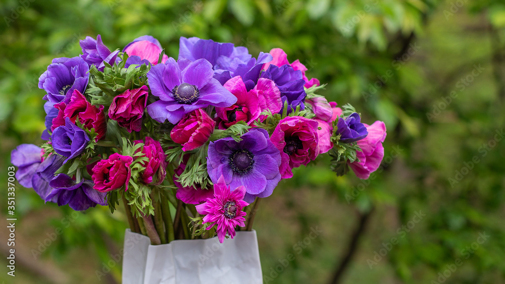 Pink, Purple & Red Cut-flower bouquet in vase.