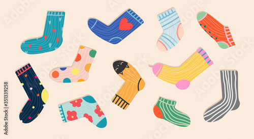 Set of trendy colorful socks. Hand-drawn accessories. Modern socks in different colors top-down view. Cartoony design for web and print.