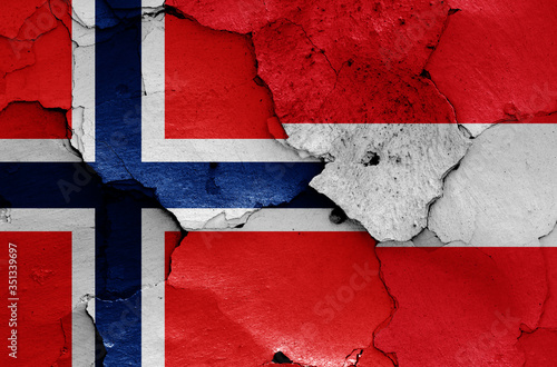 flags of Norway and Austria painted on cracked wall