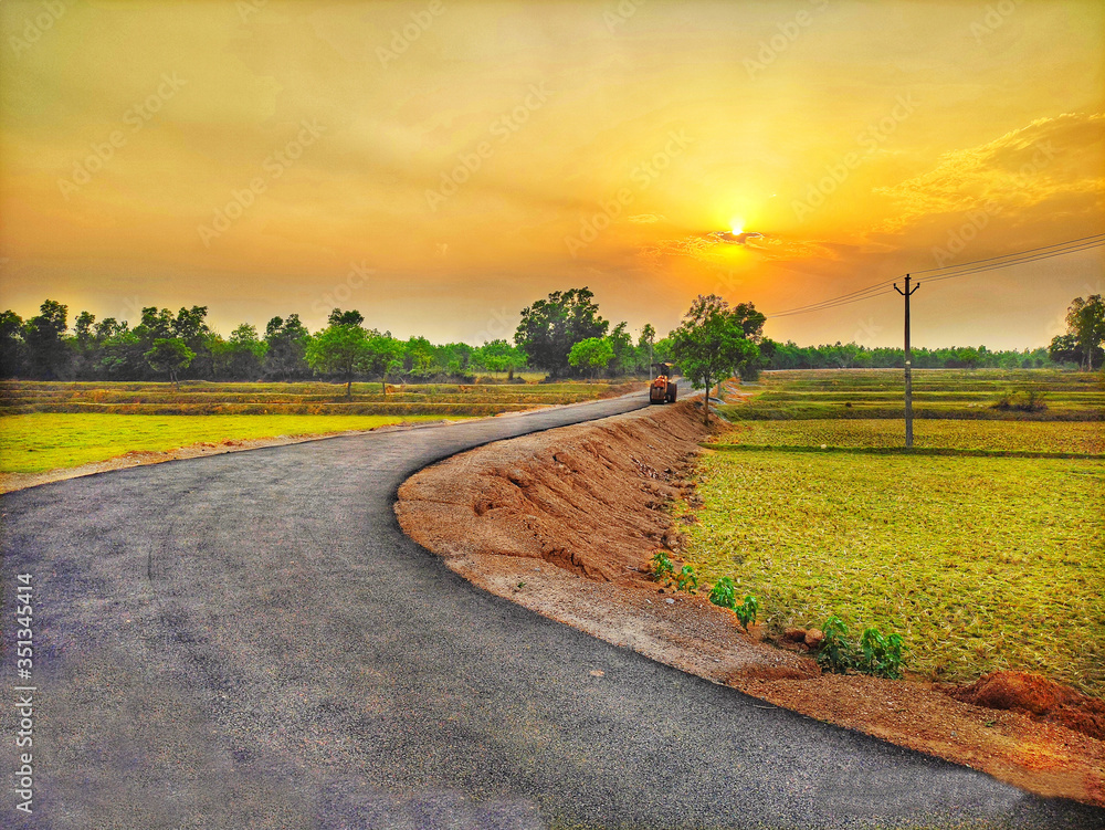 Naklejka premium Evening view of village road.