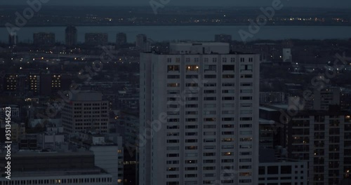 MONTREAL, QUEBEC - October 12, 2019: Montreal Quebec's downtown core as seen from a distance revealing urban buildings, traffic and mural of legendary Leonard Cohen photo