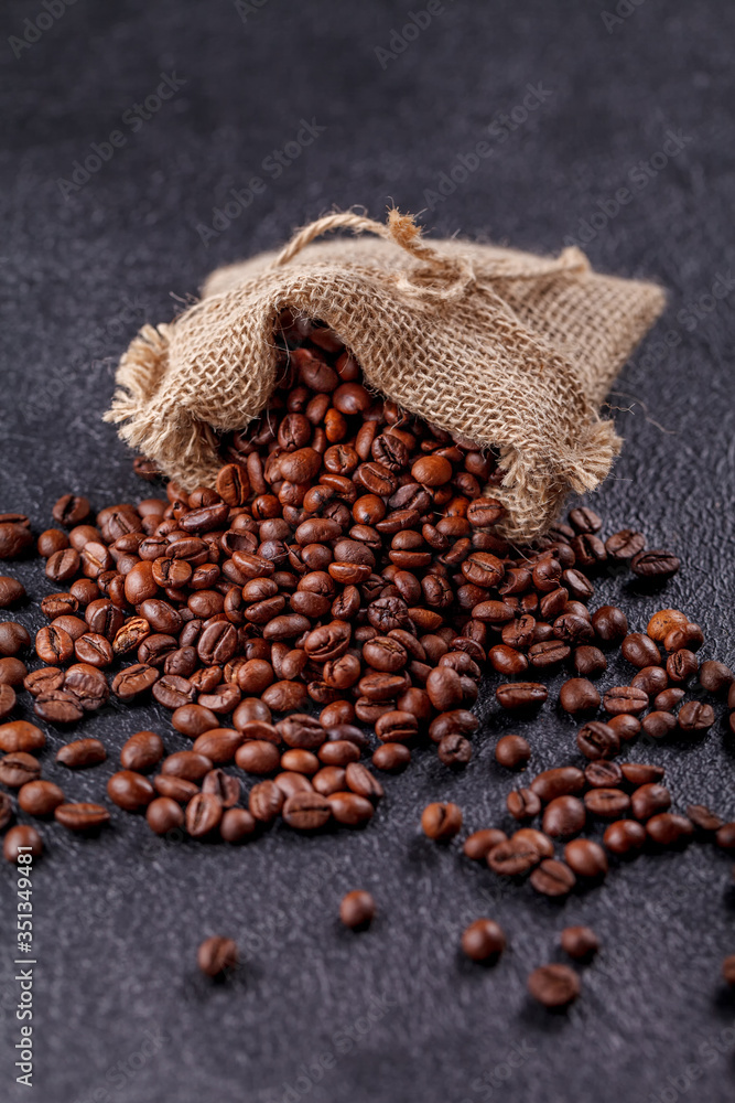Canvas bag with coffee beans on a beautiful black background