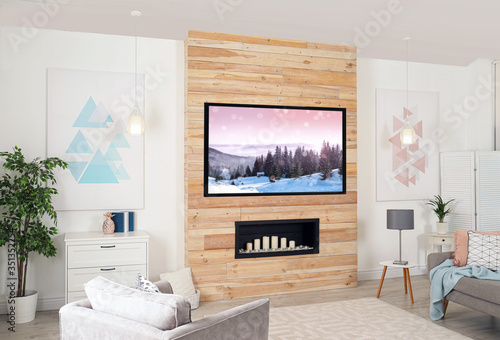 Living room interior with modern TV on wooden wall