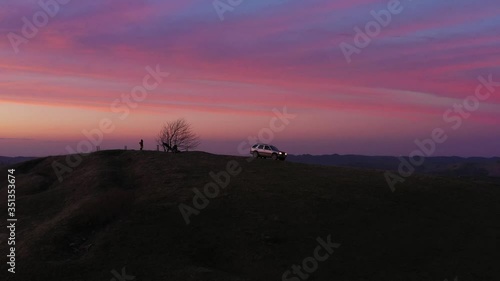Wallpaper Mural drone flight around a car standing on top of a mountain during an incredible sunset Torontodigital.ca