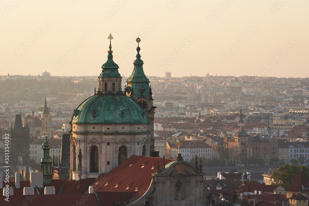 Beautiful green copper roof of Saint Nicolas church dome in Lesser town of Prague, capitol town of Czech republic. Dome of this church is iconic example of central european baroque style architecture.