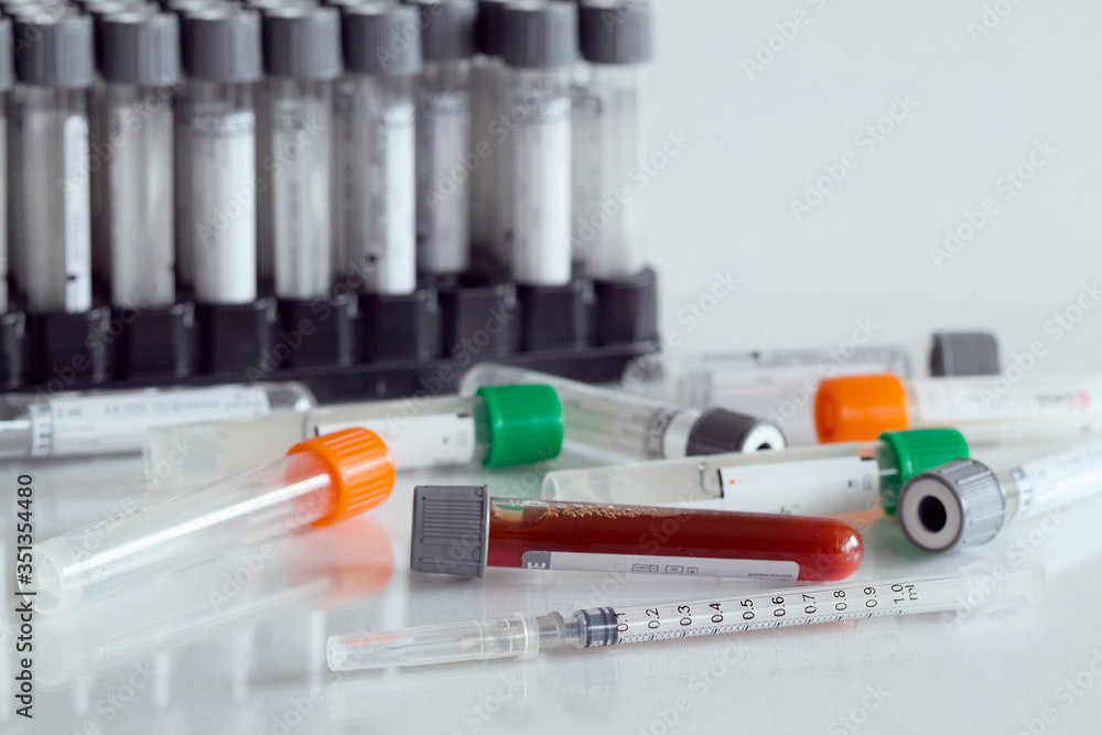 close-up medical syringe and needle with test tubes for vaccines isolated on white background. Healthcare medical. hygiene concept. Prevent coronavirus. close-up medical syringe and needle with test tubes for vaccines isolated on white background. Healthcare medical. hygiene concept. Prevent coronavirus.