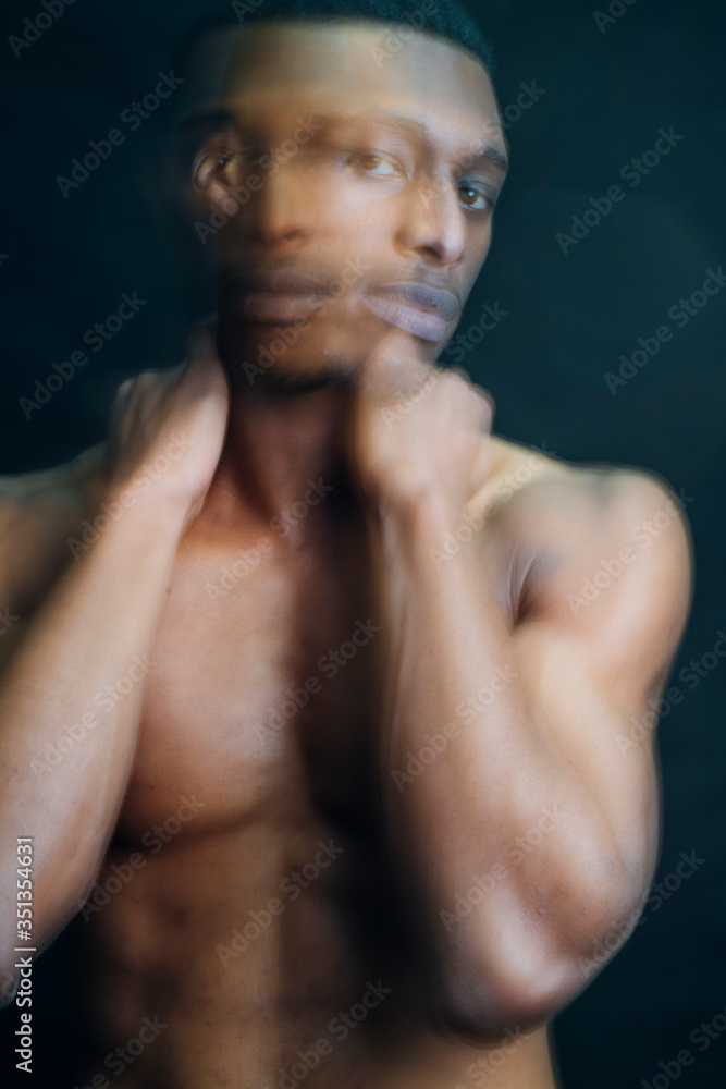 Double exposure portrait of nude young man in studio Double exposure portrait of nude young man in studio