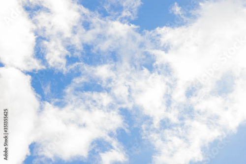 Blue sky with clouds. White cloud. Blue background