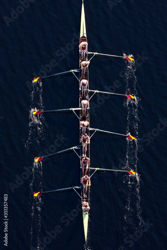 Elevated view of rowing eight in water photo