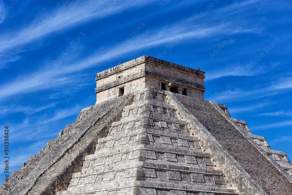 Mayan pyramid of Kukulcan against blue sky at Chichen Itza, Mexico Mayan pyramid of Kukulcan against blue sky at Chichen Itza, Mexico
