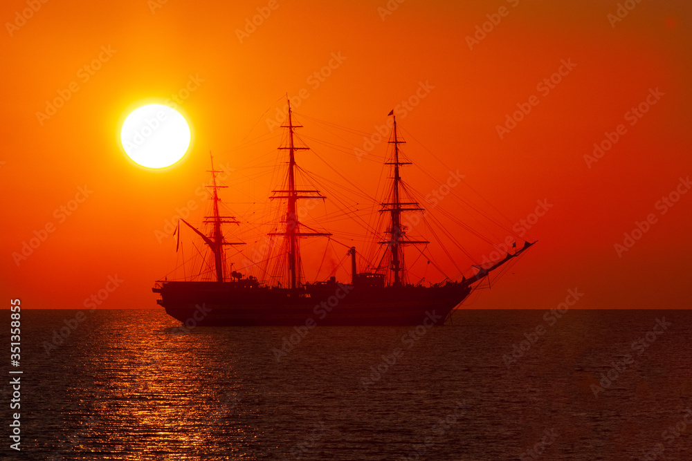 The ship of the Italian Navy Amerigo Vespucci, at sunset, in front of the city of Livorno The ship of the Italian Navy Amerigo Vespucci, at sunset, in front of the city of Livorno