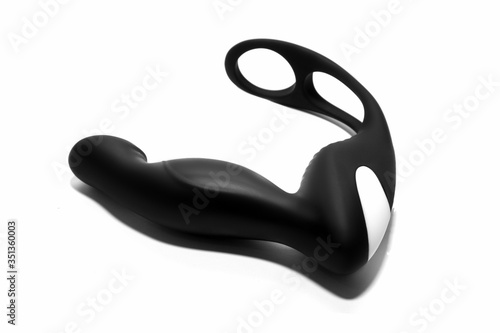Black silicone prostate massager on white background. Anal plug.