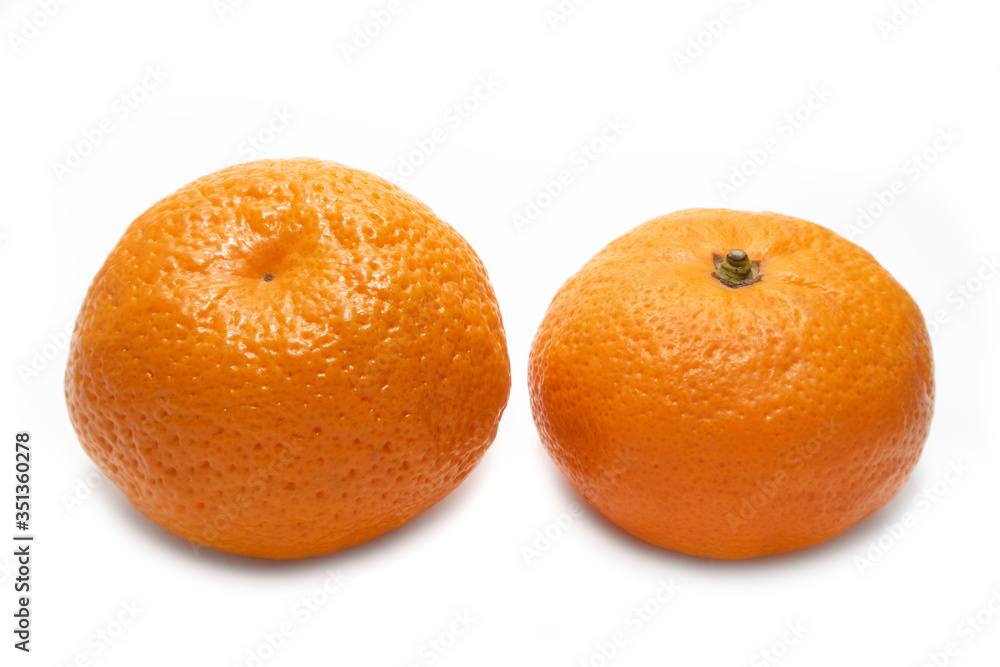Mandarin isolated on a white background. The symbol of the holiday season. Mandarin isolated on a white background. The symbol of the holiday season.
