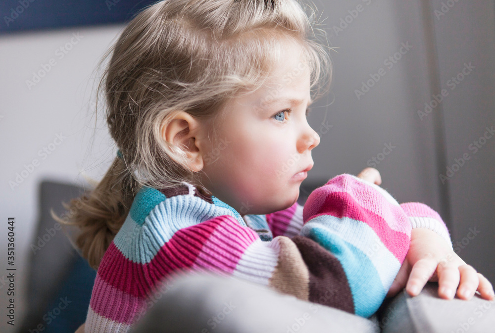 Portrait of girl looking out of the window Portrait of girl looking out of the window