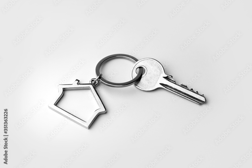 Macro view of silver key on the white background Macro view of silver key on the white background