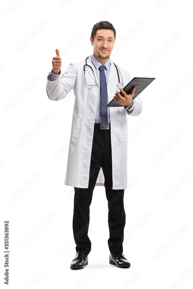 Young male doctor showing thumbs up isolated on white background Young male doctor showing thumbs up isolated on white background