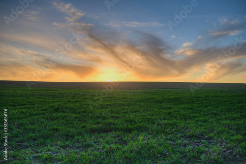 sunset over a freshly plowed field