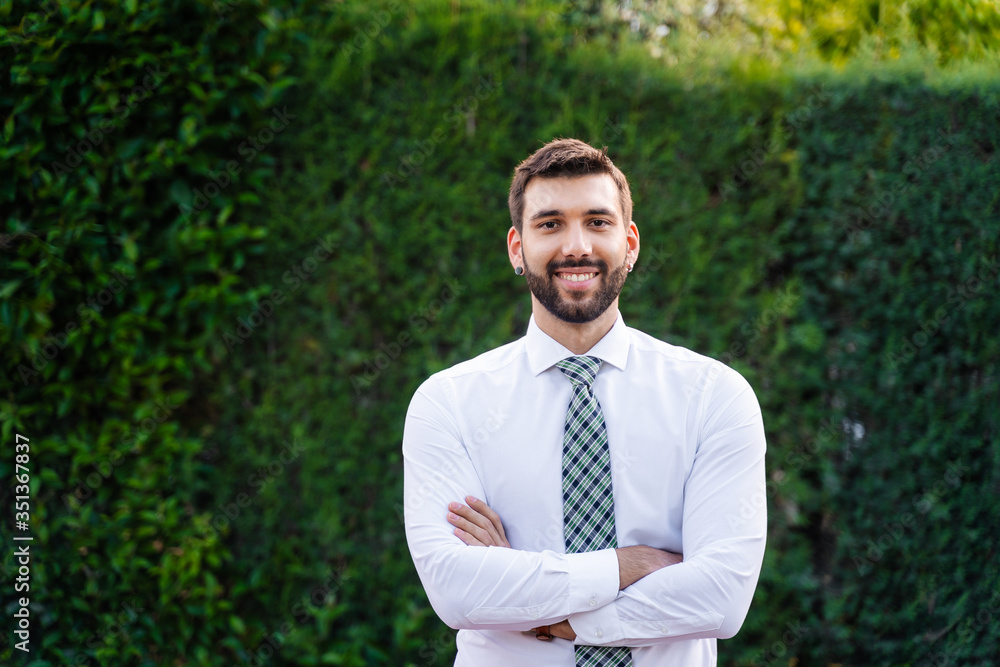 Young business man with white shirt and tie in outdoor park Young business man with white shirt and tie in outdoor park