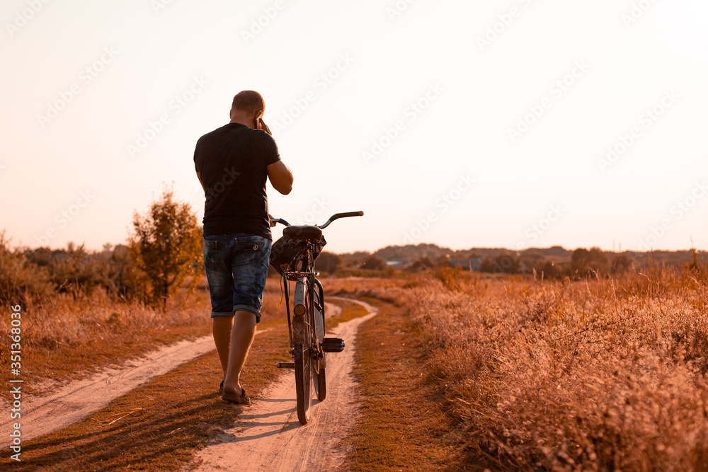 Guy with a bike in the forest Guy with a bike in the forest