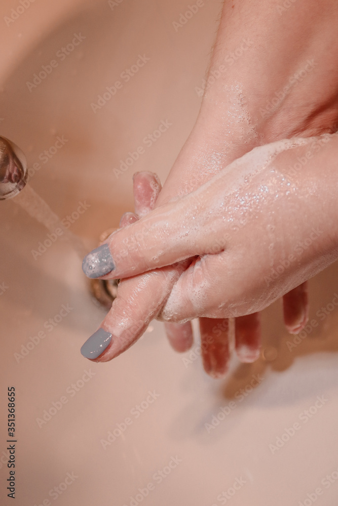 Fototapeta premium person washing hands covid 19