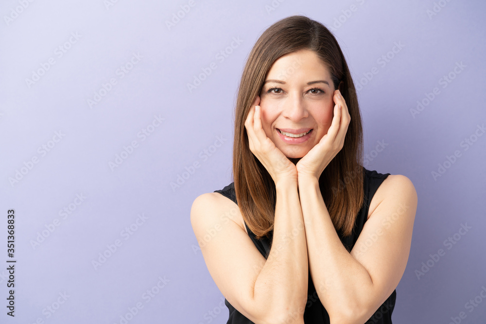 Pretty woman smiling in a studio Pretty woman smiling in a studio