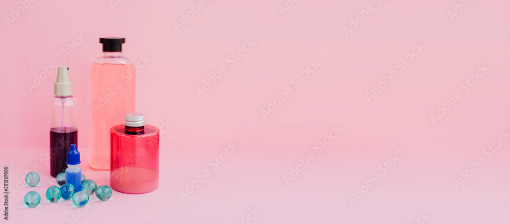 A set of toiletries, jars of body cosmetics. Deodorant, shampoo, spray, cream, scrub, bath balls on a pink background. Personal care concept.
A set of toiletries, jars of body cosmetics. Deodorant, shampoo, spray, cream, scrub, bath balls on a pink background. Personal care concept.