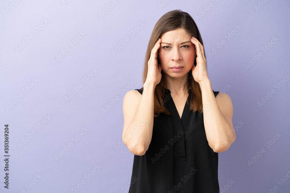 Stressed woman with a headache Stressed woman with a headache