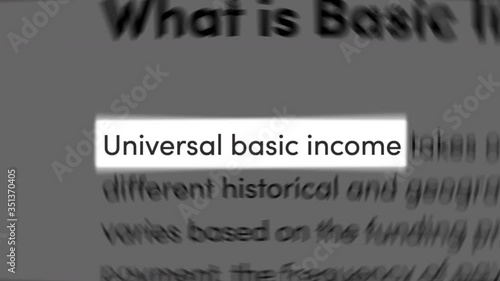 'Universal Basic Income' text centered among random paragraphs, similar to news articles on the web. Concept of UBI, citizen's basic income, basic income guarantee, basic living stipend. photo