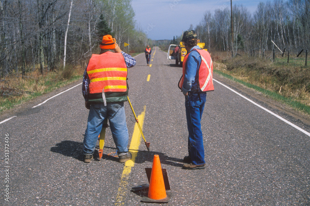 County surveyors and equipment on a highway, WI