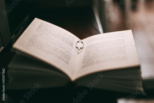 Wedding ring and book