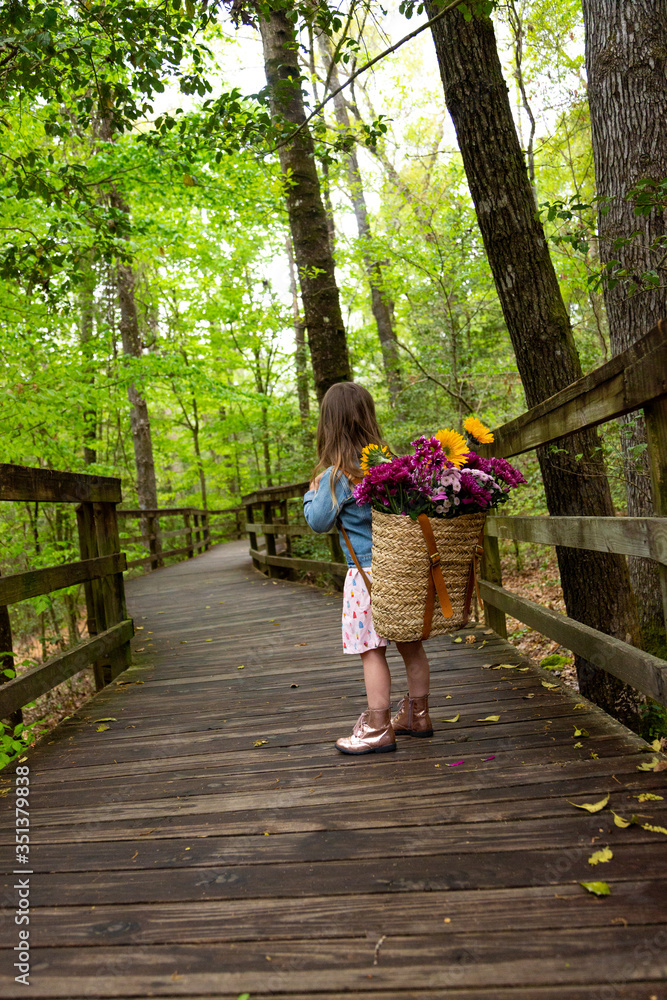 Girl in Jean Jacket with Flowers in Woods Girl in Jean Jacket with Flowers in Woods