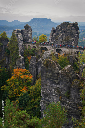 The Bastei stone bridge in the Saxon Switzerland National Park near Dresden  Germany on a foggy autumn day.