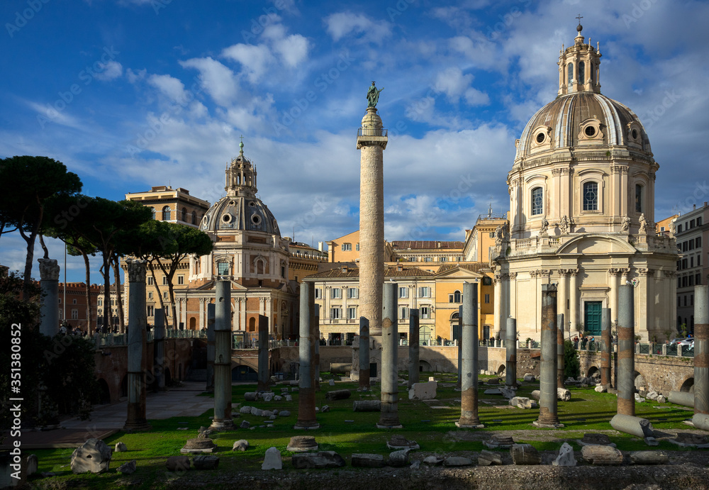 Rome, Italy: in close up archaeological ruins of the square  of Trajan Forum, in the center the Trajan Column, on the right the church of Santissimo Nome di Maria