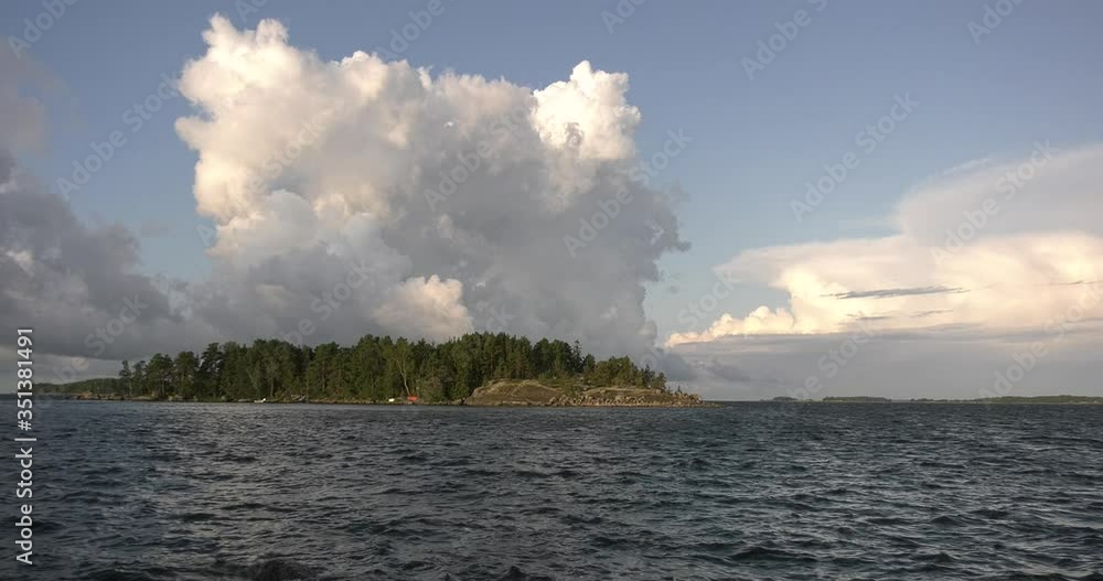 4K summer morning high quality video of Santalahti Baltic Sea Finnish Bay lagoon, pine tree forest beach with red granite boulders, lone island beach near Kotka, Finland Suomi, northern Europe 4K summer morning high quality video of Santalahti Baltic Sea Finnish Bay lagoon, pine tree forest beach with red granite boulders, lone island beach near Kotka, Finland Suomi, northern Europe