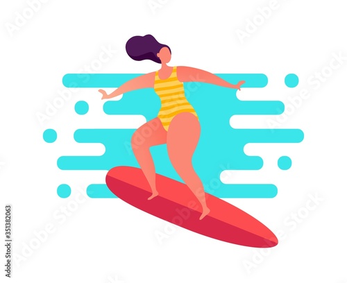 Woman surfing on the swell in striped swimwear.