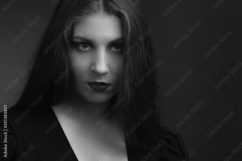 Black and white portrait of young fat girls brunette with long hairblack dress with sweetheart neckline