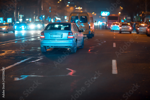 cars in night light street